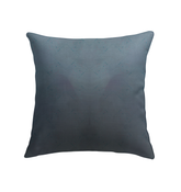 Lily Lullaby Pillow placed on a cozy living room sofa
